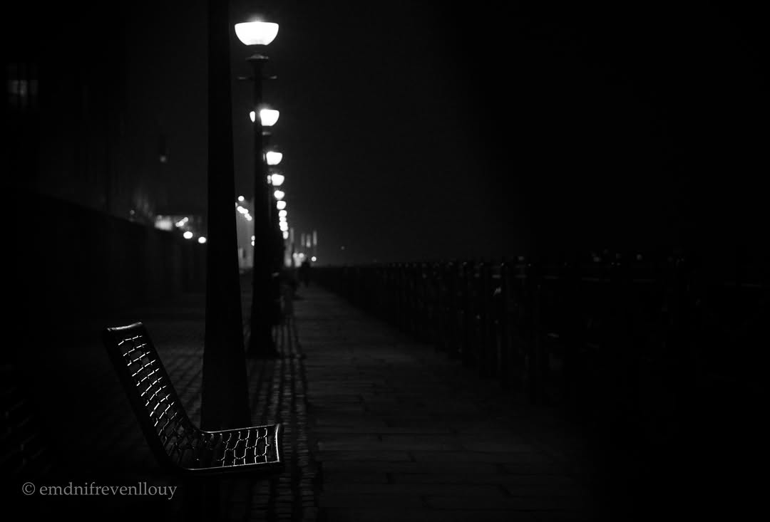 Liverpool waterfront at night, lamp posts leading into the dark — T&DSHOTS